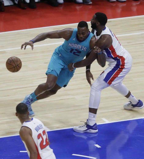 Detroit Pistons center Andre Drummond (0) knocks the ball away from Charlotte Hornets center Dwight Howard (12) during the first half of an NBA basketball game, Wednesday, Oct. 18,2017, in Detroit. Photo: Carlos Osorio, AP / Copyright 2017 The Associated Press. All rights reserved.